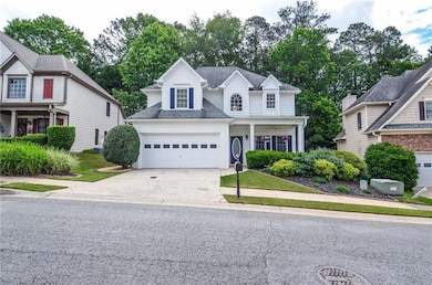 Traditional-style house featuring driveway, an att