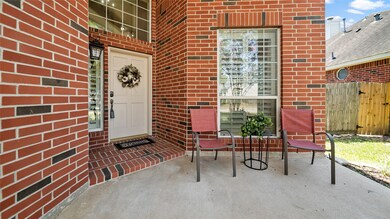 Welcoming porch perfect for morning cups of coffee or passing out candy to trick-or-treaters.