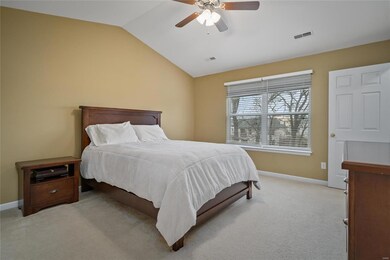 Owner's bedroom suite offers vaulted ceiling