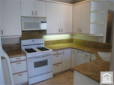 Kitchen with Granite counters and marble floors