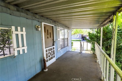The mature landscaping provides a sense of privacy while out on the porch.