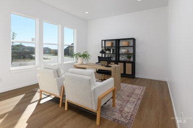 Home office with wood finished floors and recessed lighting