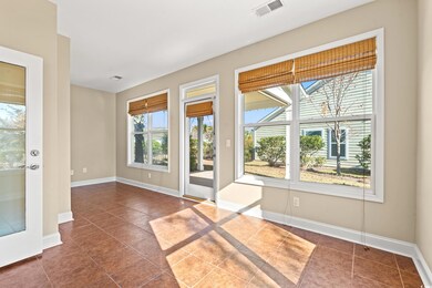 Entryway with dark tile patterned floors