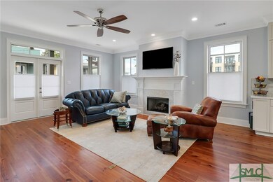 The living room highlights a beautiful fireplace f