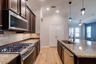 Upgraded stainless steel appliances include a five-burner gas cooktop, easy touch microwave and dishwasher. The double door pantry holds all the best snacks!