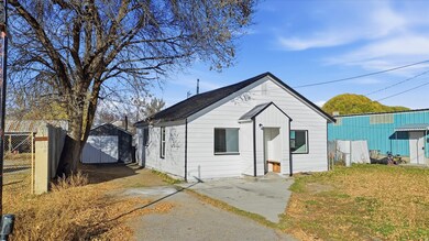 Bungalow-style house featuring a storage shed