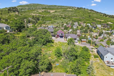 Aerial view of residential area featuring a mountainous background