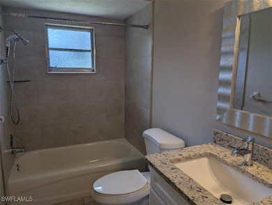 Bathroom featuring vanity and shower / washtub com