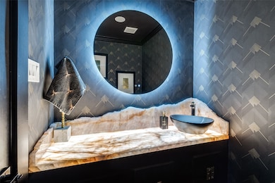 Beautiful Half-Bath with Onyx countertop.
