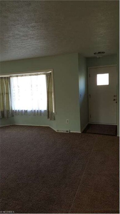 Living room with bay window and new carpet