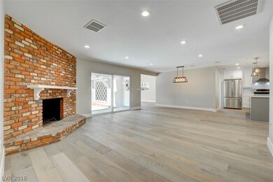LIVING ROOM WITH BEAUTIFUL BRICK WOOD BURNING FIRE