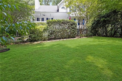 View of grassy yard with ceiling fan