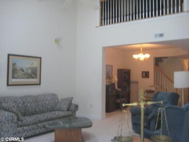Living Room - Open to dining area which offers car