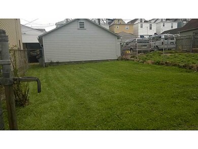Exterior Back. garage and yard