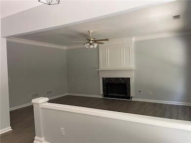 Unfurnished living room with dark wood finished fl