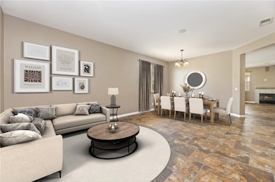 Living room upon entry virtually staged to showcase room potential