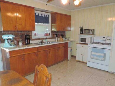 Kitchen. Original hardwood cabinets