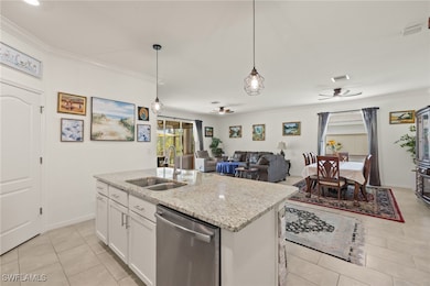 Kitchen with dishwasher, a double sink, ceiling fa