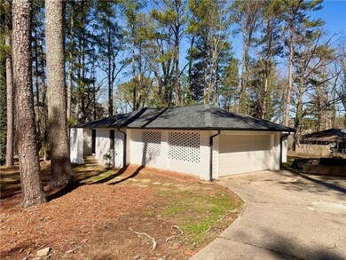 Large driveway with attached 2 car garage