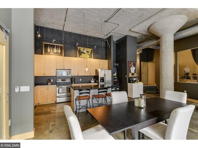 Center island kitchen with stainless appliances is