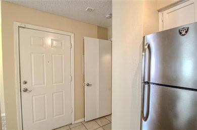 Kitchen featuring light tile patterned flooring, w