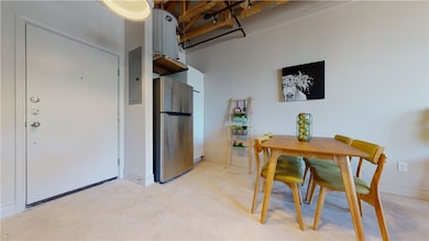 Dining space with concrete flooring and electric p