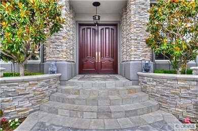 Gorgeous mahogany custom doors lead you in to noth