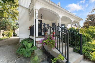 Entrance to property featuring a porch and a chimney