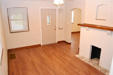 Living Room w/New Front Door, Laminated Floor and 