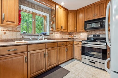 Kitchen with beautiful cabinets and easy flow to d