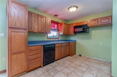 Kitchen with oak cabinets and lovely view.