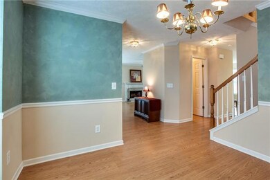Formal Dining Room with a view of the Foyer, Living Room, Powder Room and Stairs