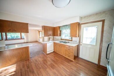 Kitchen with door to deck and yard