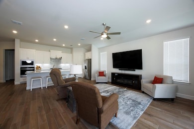Living room with dark wood-style flooring, ceilin