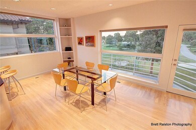 Large breakfast nook area with windows galore and