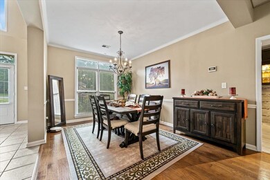 Dining area with a chandelier, light wood-style fl