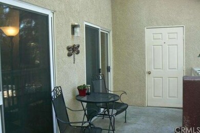 Upper unit with large patio area including laundry