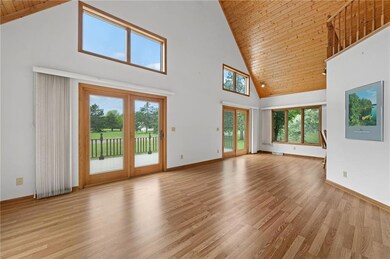 Walk in to sunshine and vaulted pine ceilings.