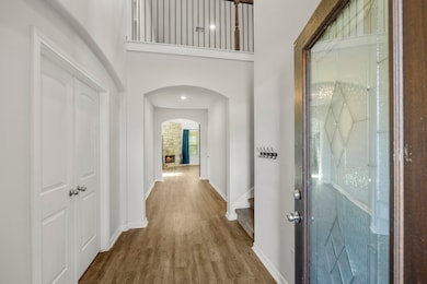 Step inside to a bright and open entryway, where t