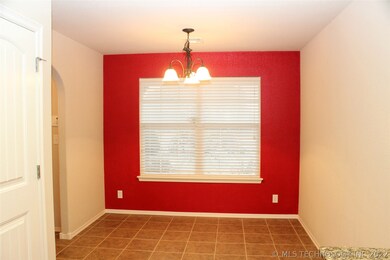 Dining area with red accent wall