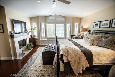 Upstairs master bedroom boasting romantic fireplace.