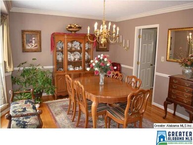 SPACIOUS DINING ROOM W/ NEUTRAL DECOR, BAY WINDOW, HARDWOOD FLOORS AND CROWN MOULDING
