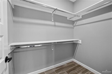 Spacious closet featuring wood tiled floor