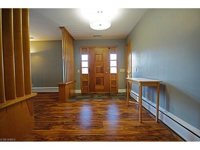With a slate threshold and laminate hard wood floo