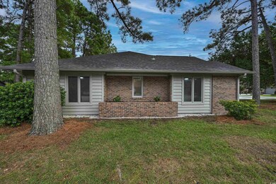 Single story home with a front lawn