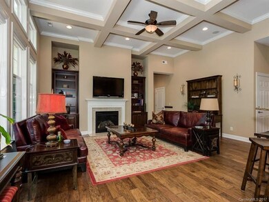 Great room/Family room has coffered ceilings with 