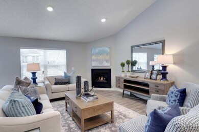 Main level entertaining space includes a cozy gas 