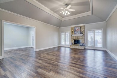 Unfurnished living room with brick wall, a brick f
