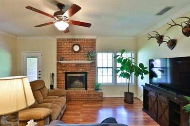 focal point of the living room is a wood burning b