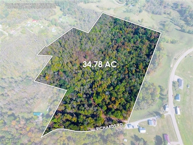 Aerial overview of property's location featuring property boundaries highlighted